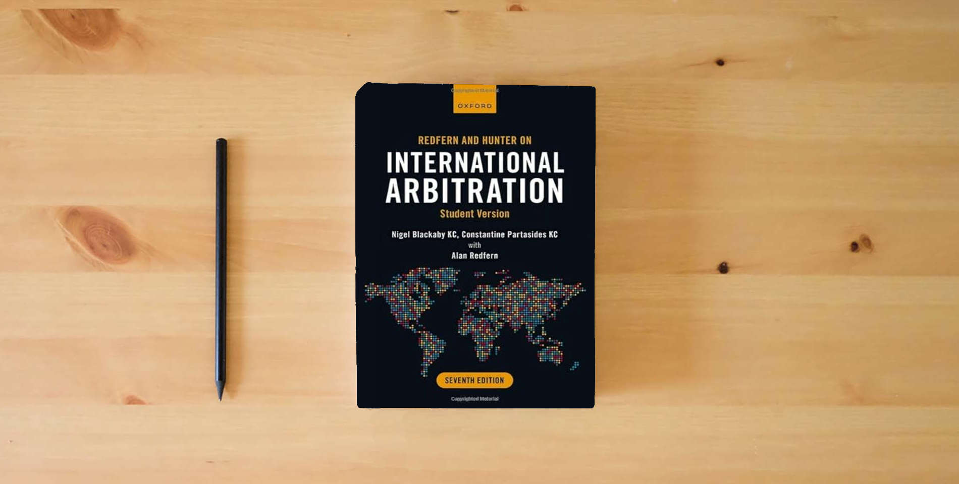 The book Redfern and Hunter on International Arbitration: Student Version is on the table