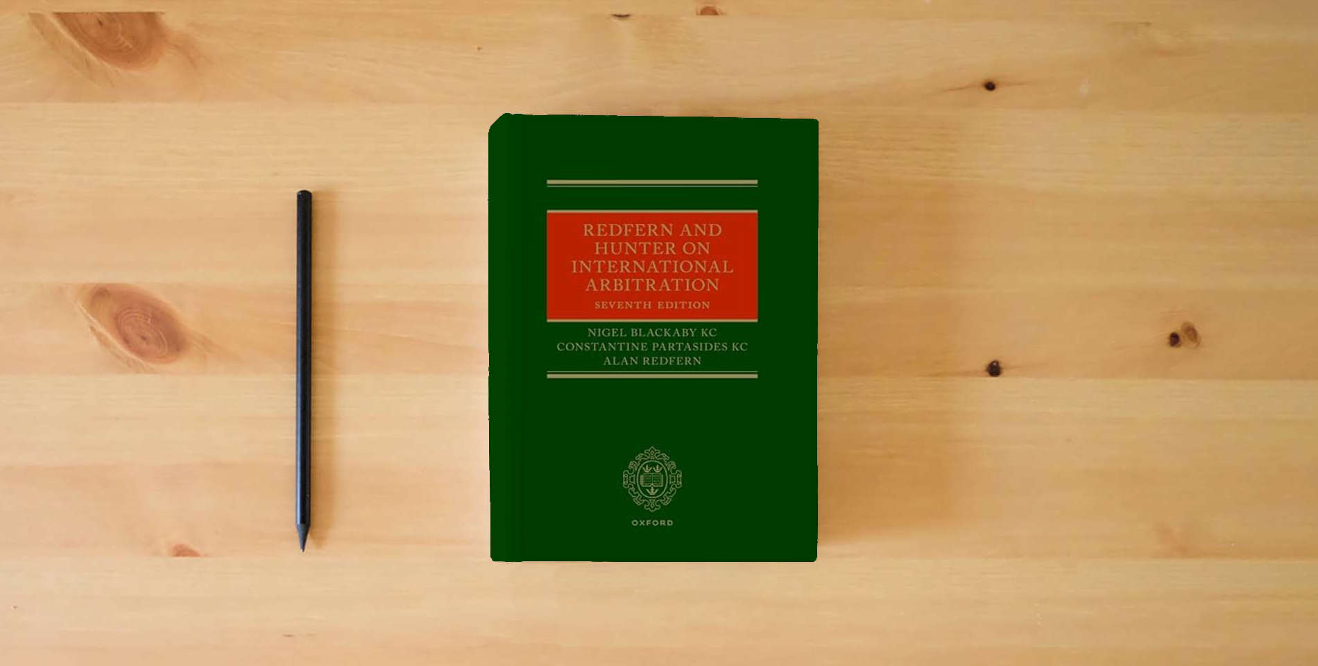 The book Redfern and Hunter on International Arbitration is on the table