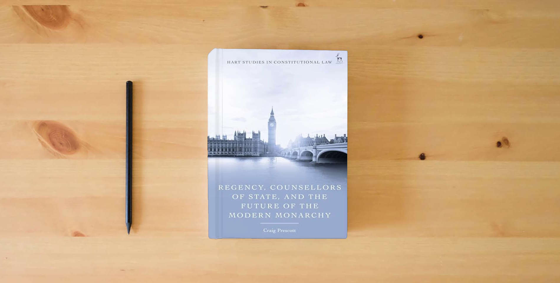 The book Regency, Counsellors of State, and the Future of the Modern Monarchy (Hart Studies in Constitutional Law) is on the table
