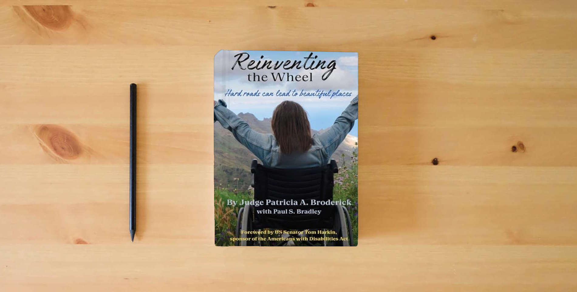 The book Reinventing the Wheel: Hard Roads Can Lead to Beautiful Places is on the table