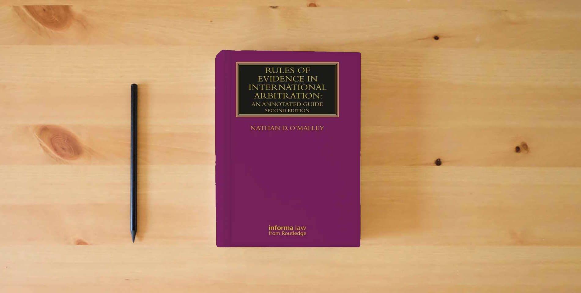 The book Rules of Evidence in International Arbitration: An Annotated Guide (Lloyd's Arbitration Law Library) is on the table