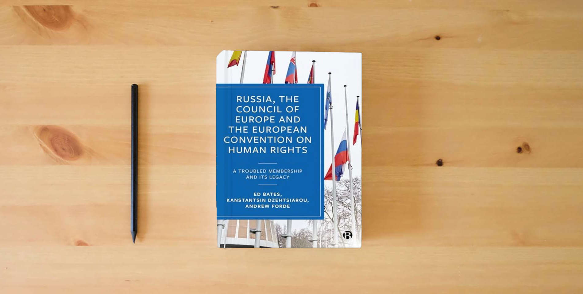 The book Russia, the Council of Europe & the European Convention: A Troubled Membership and Its Legacy is on the table