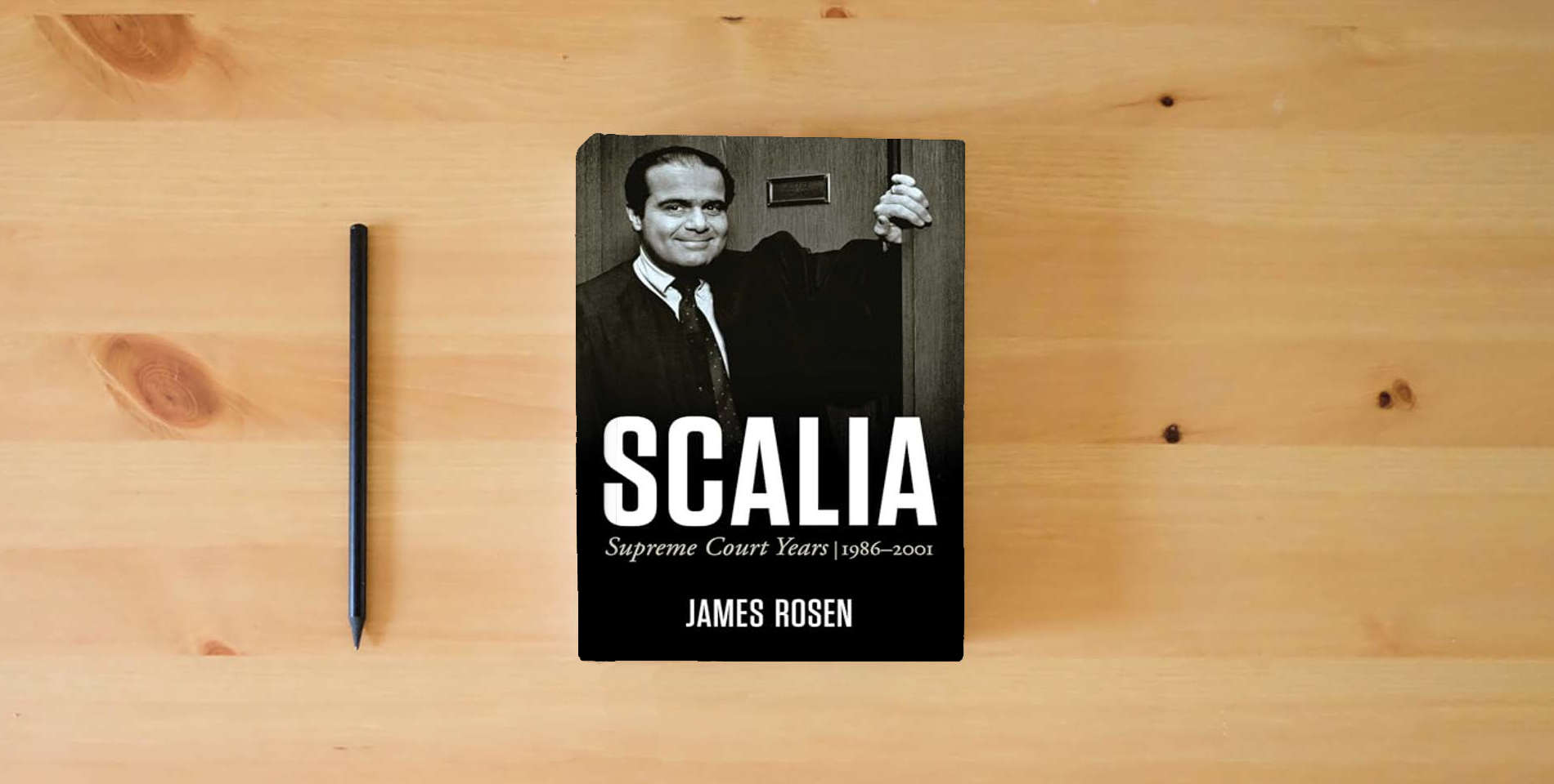 The book Scalia: Supreme Court Years, 1986 to 2001 is on the table