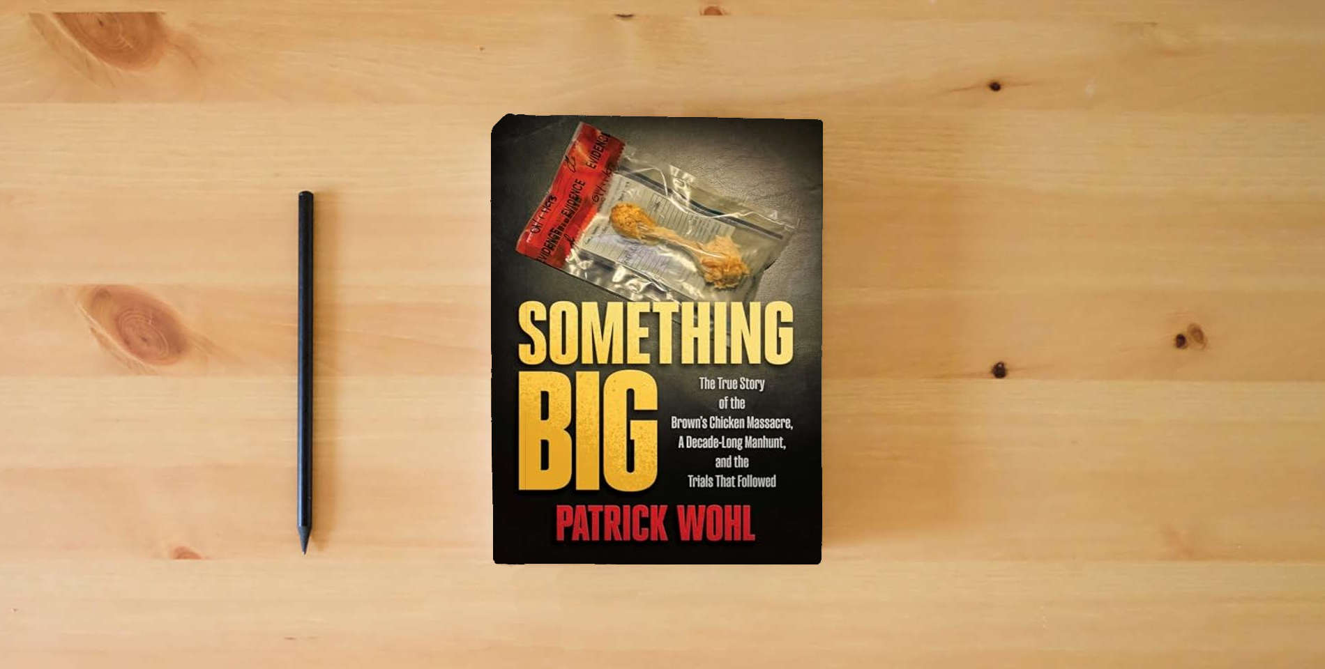 The book Something Big: The True Story of the Brown's Chicken Massacre, A Decade-Long Manhunt, and the Trials That Followed is on the table