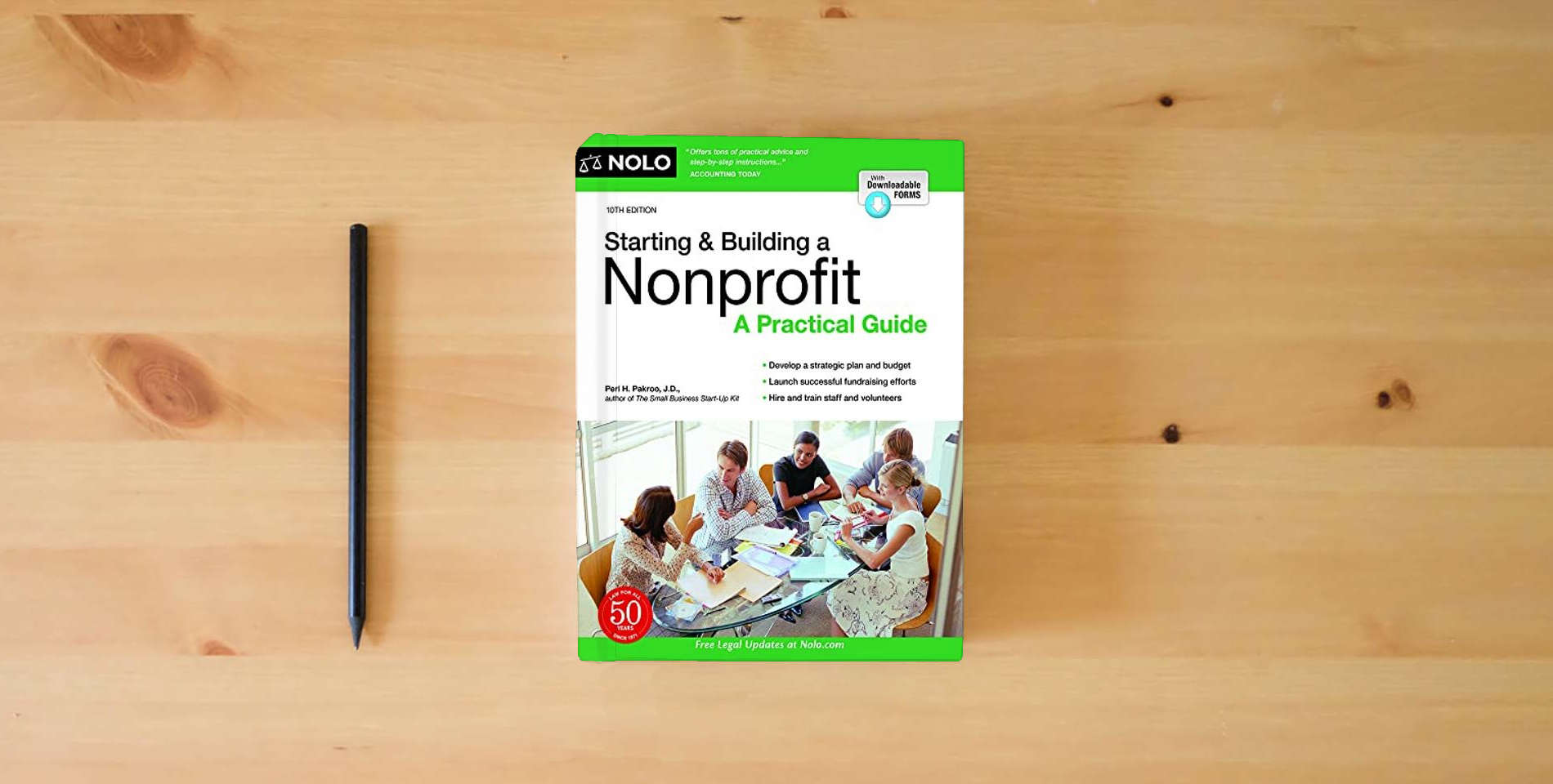 The book Starting & Building a Nonprofit: A Practical Guide is on the table