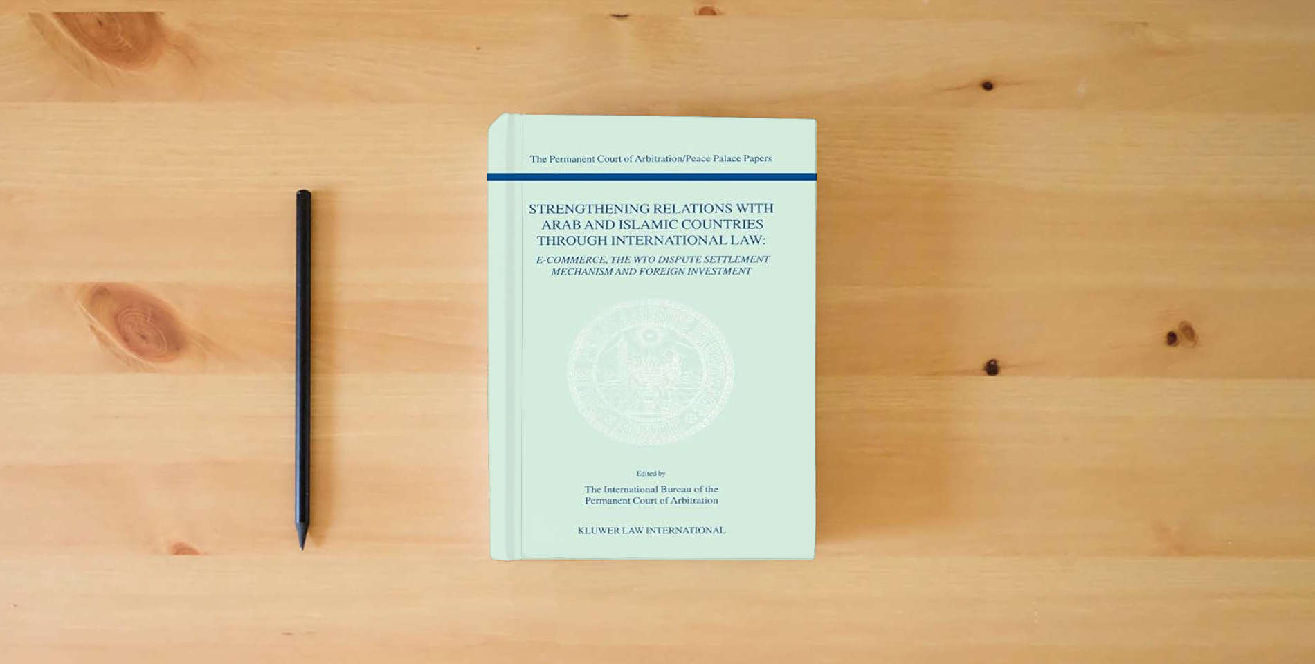 The book Strengthening Relations with Arab and Islamic Countries Through International Law:E-Commerce, the WTO Dispute Settlement Mechanism, and Foreign ... of Arbitration/Peace Palace Papers, V. 4) is on the table