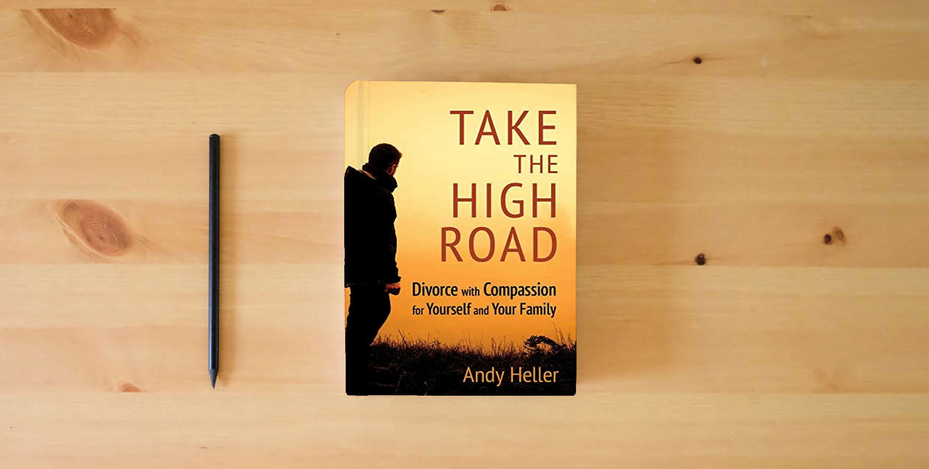 The book Take the High Road: Divorce with Compassion for Yourself and Your Family is on the table