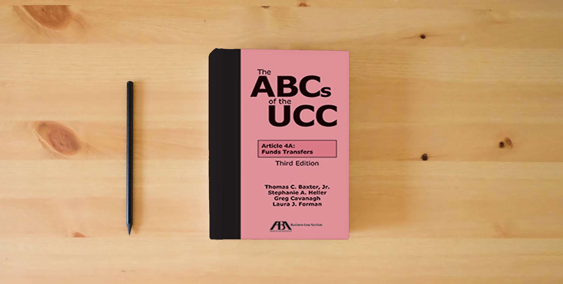 The book The ABCs of the UCC Article 4A: Funds Transfers is on the table