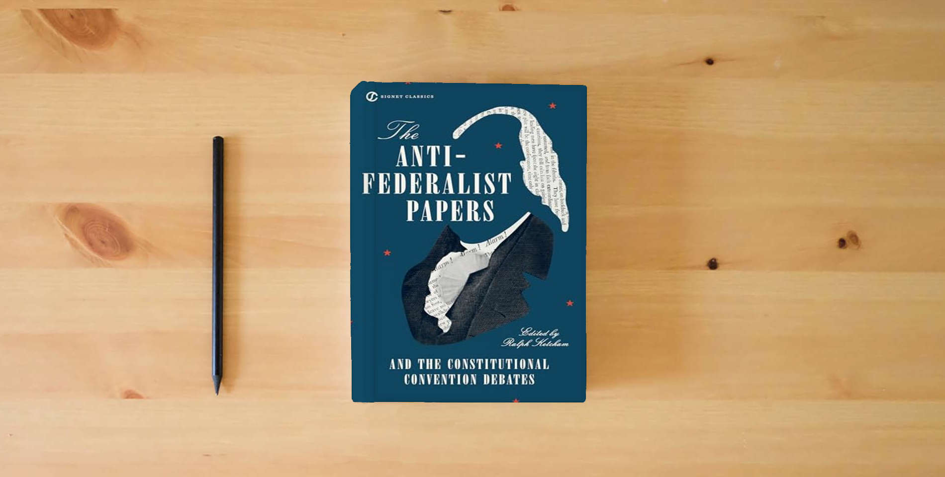 The book The Anti-Federalist Papers and the Constitutional Convention Debates (Signet Classics) is on the table