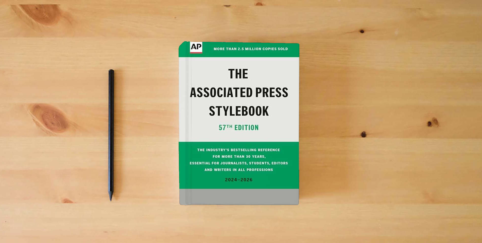 The book The Associated Press Stylebook: 2024-2026 is on the table