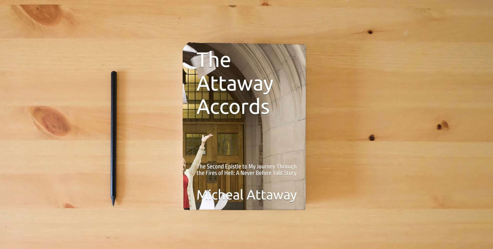 The book The Attaway Accords: The Second Epistle to My Journey Through the Fires of Hell: A Never Before Told Story (My Journey through Hell and my redemption) is on the table