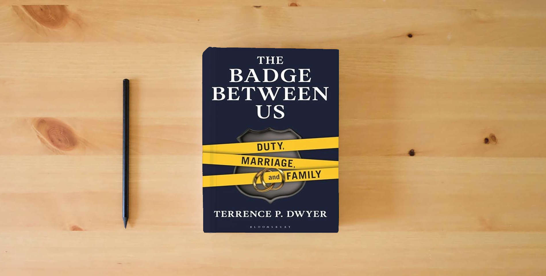 The book The Badge Between Us: Duty, Marriage, and Family is on the table