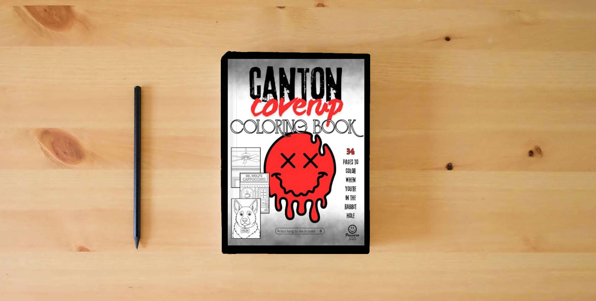 The book The Canton Coverup Coloring Book is on the table