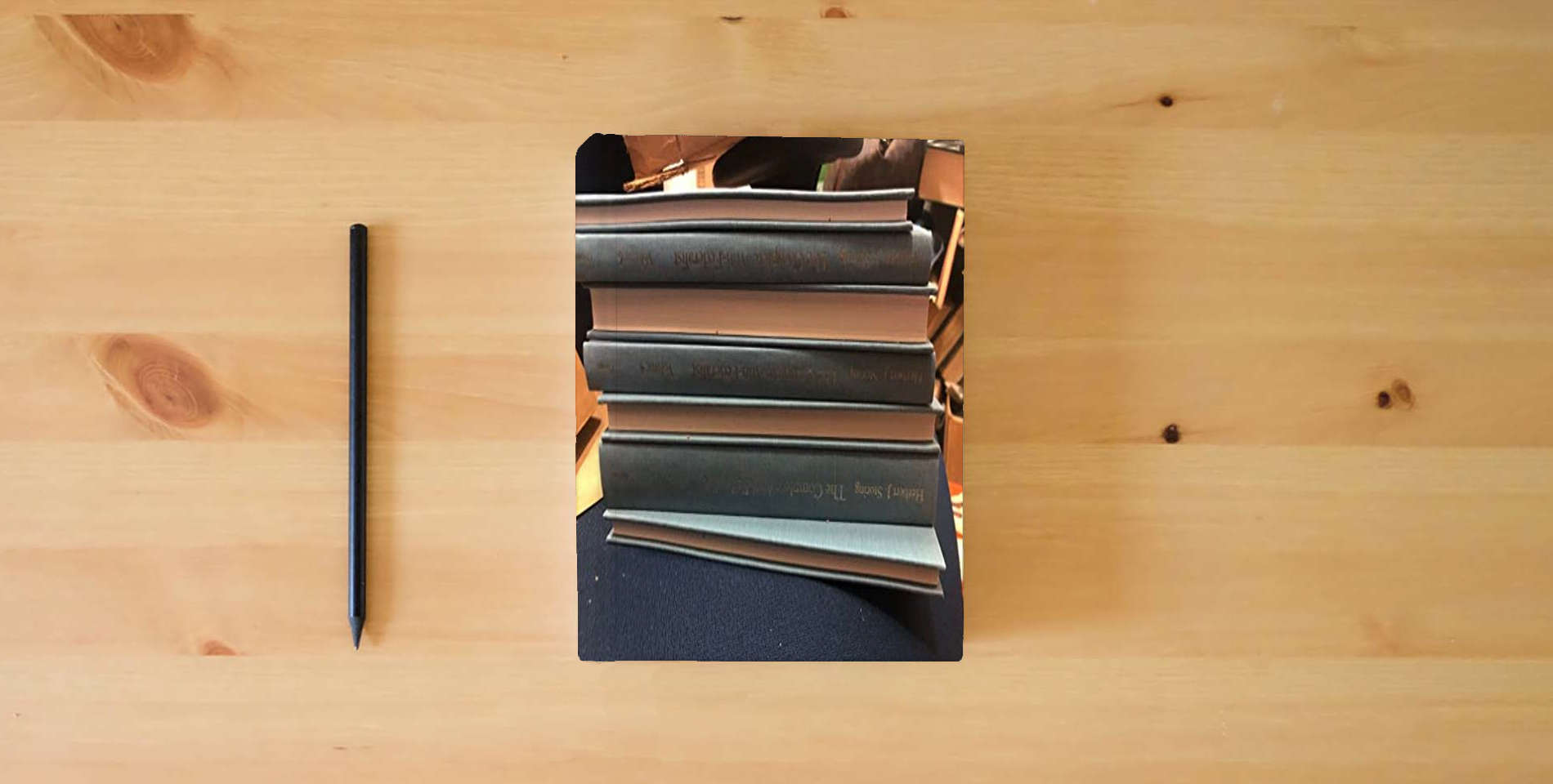 The book The Complete Anti-Federalist [Set of 7] is on the table