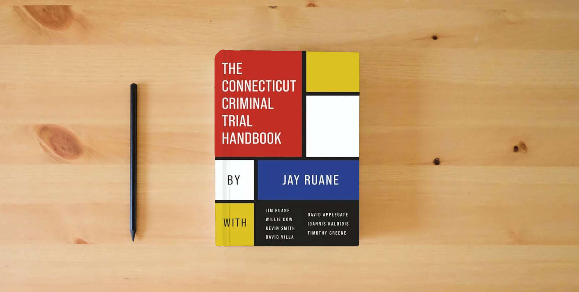 The book The Connecticut Criminal Trial Handbook is on the table
