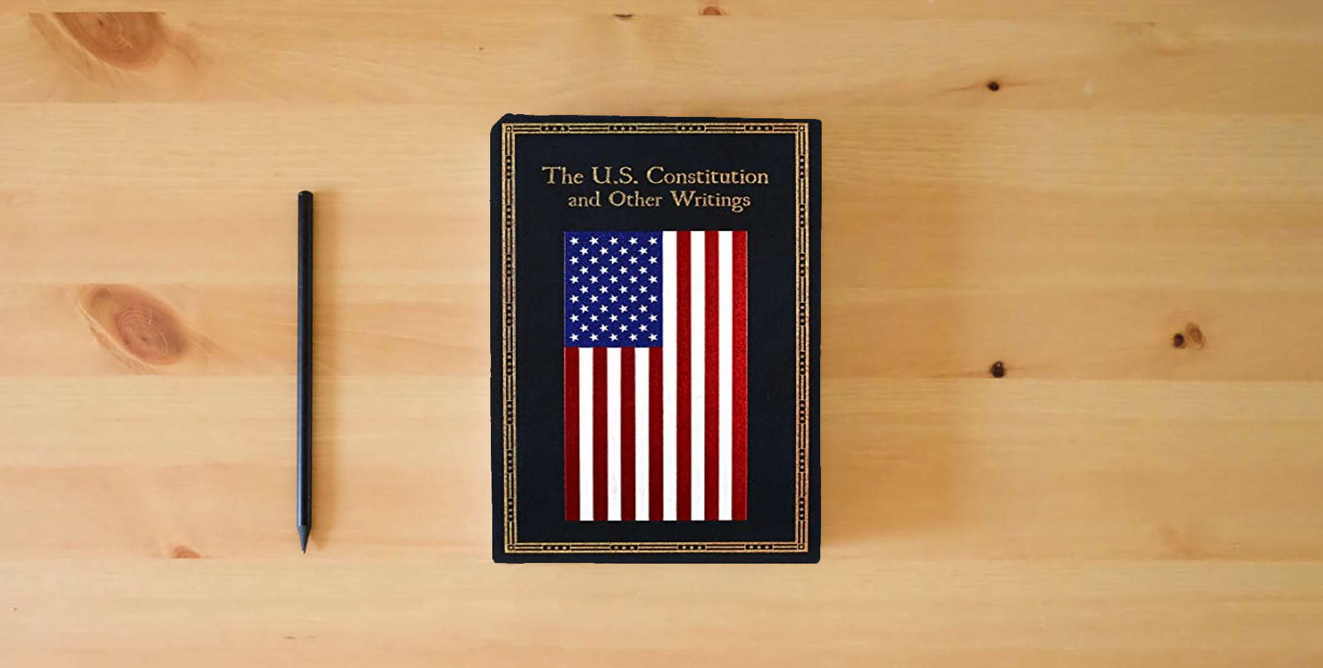 The book The U.S. Constitution and Other Writings (Leather-bound Classics) is on the table