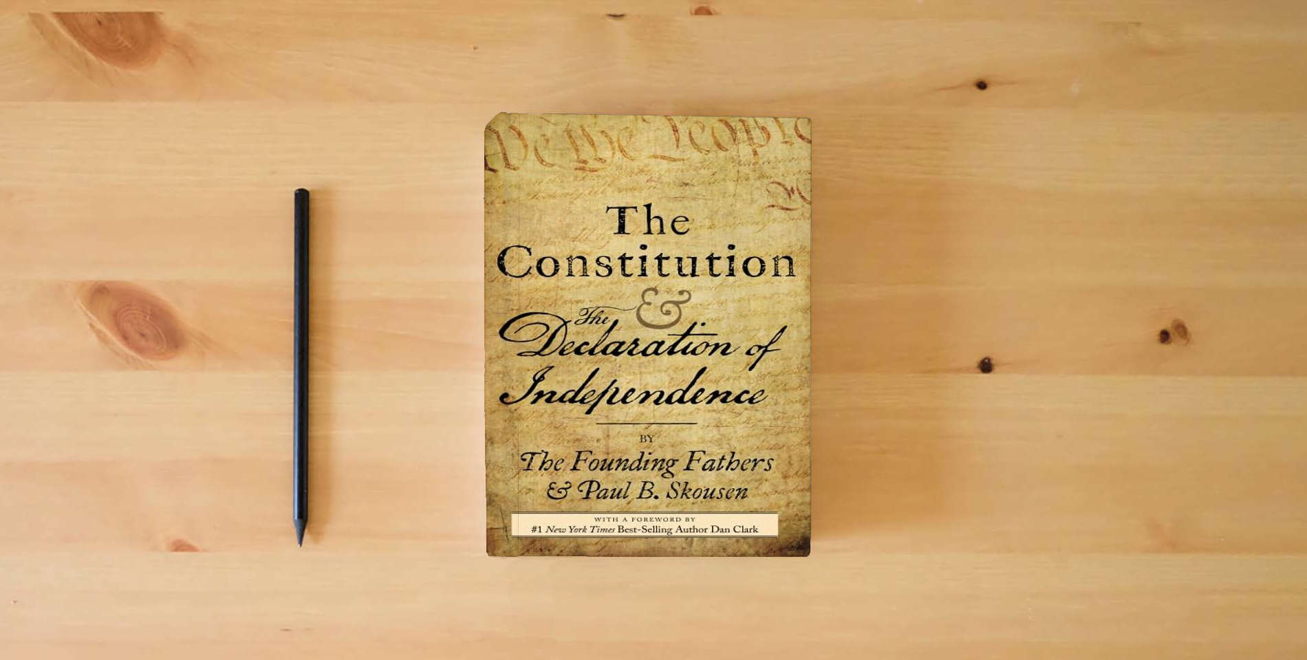 The book The Constitution and the Declaration of Independence: The Constitution of the United States of America is on the table