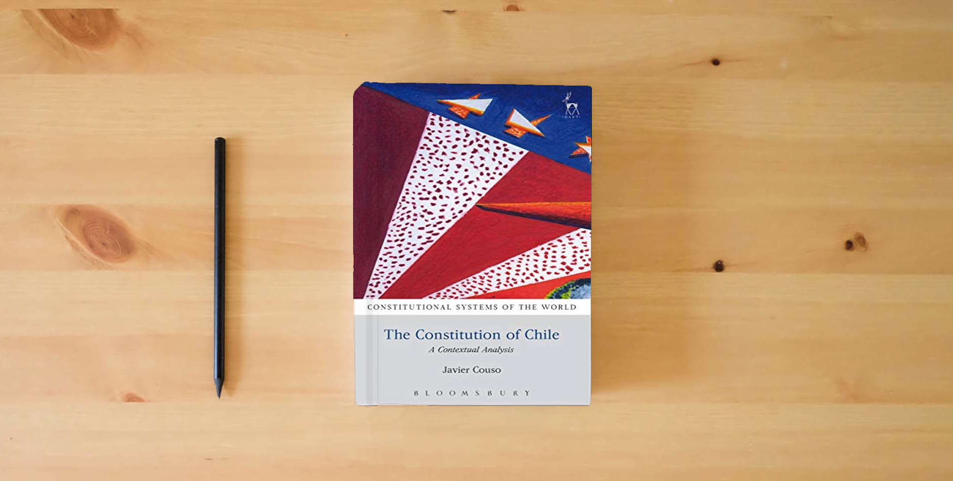 The book The Constitution of Chile: A Contextual Analysis (Constitutional Systems of the World) is on the table