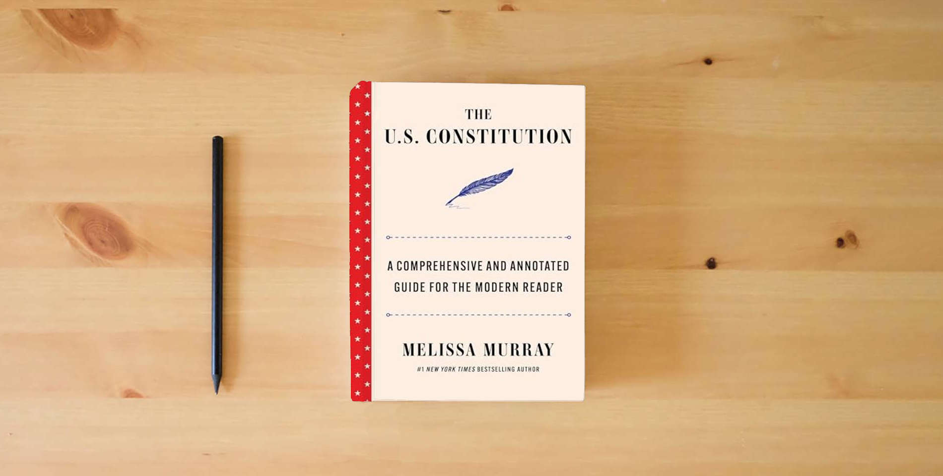 The book The U.S. Constitution: A Comprehensive and Annotated Guide for the Modern Reader is on the table