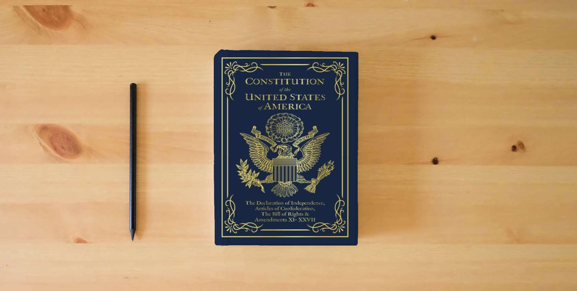 The book The Constitution of the United States of America: The Declaration of Independence, The Bill of Rights is on the table