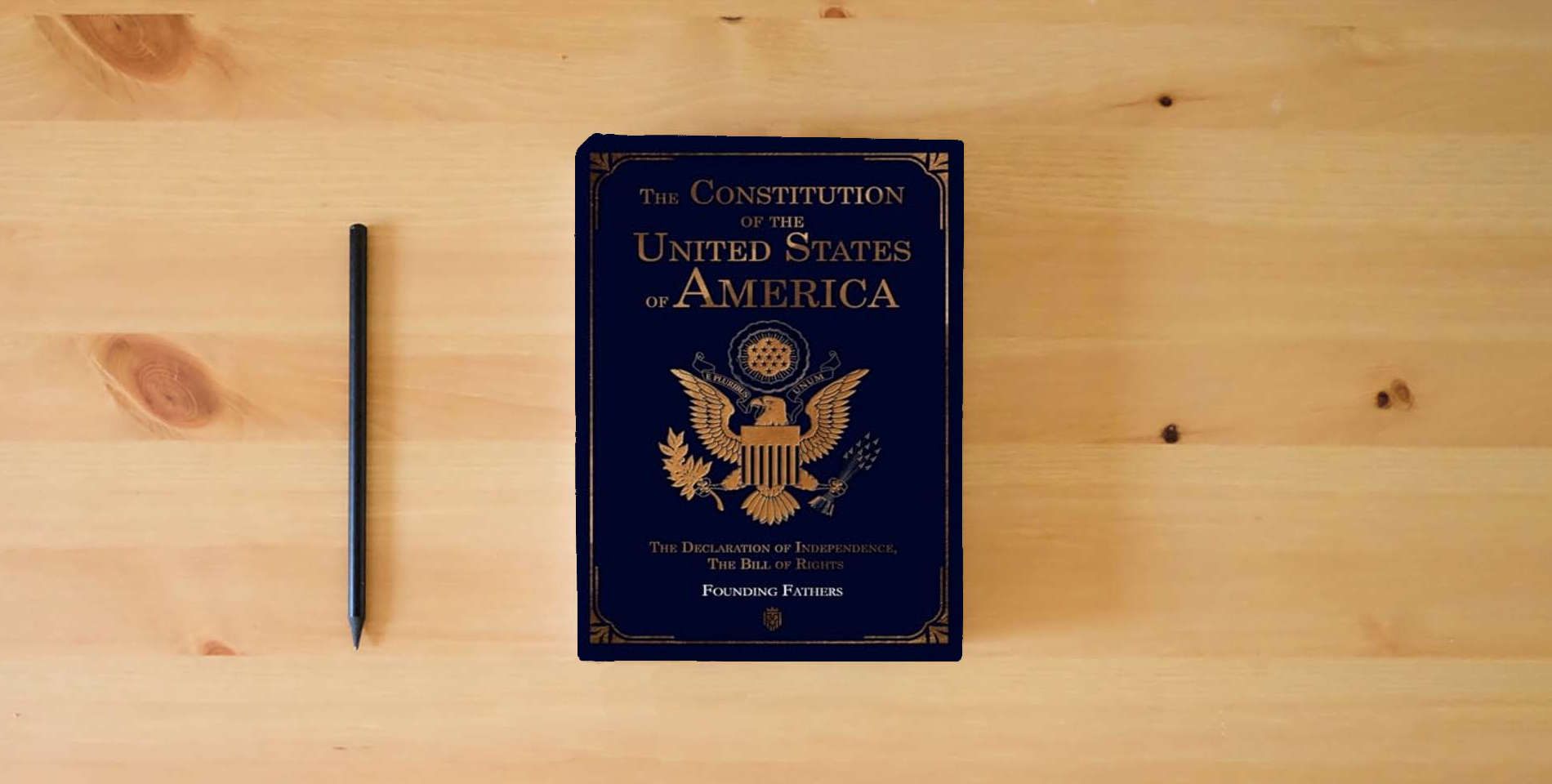The book The Constitution of the United States of America: The Declaration of Independence, The Bill of Rights is on the table