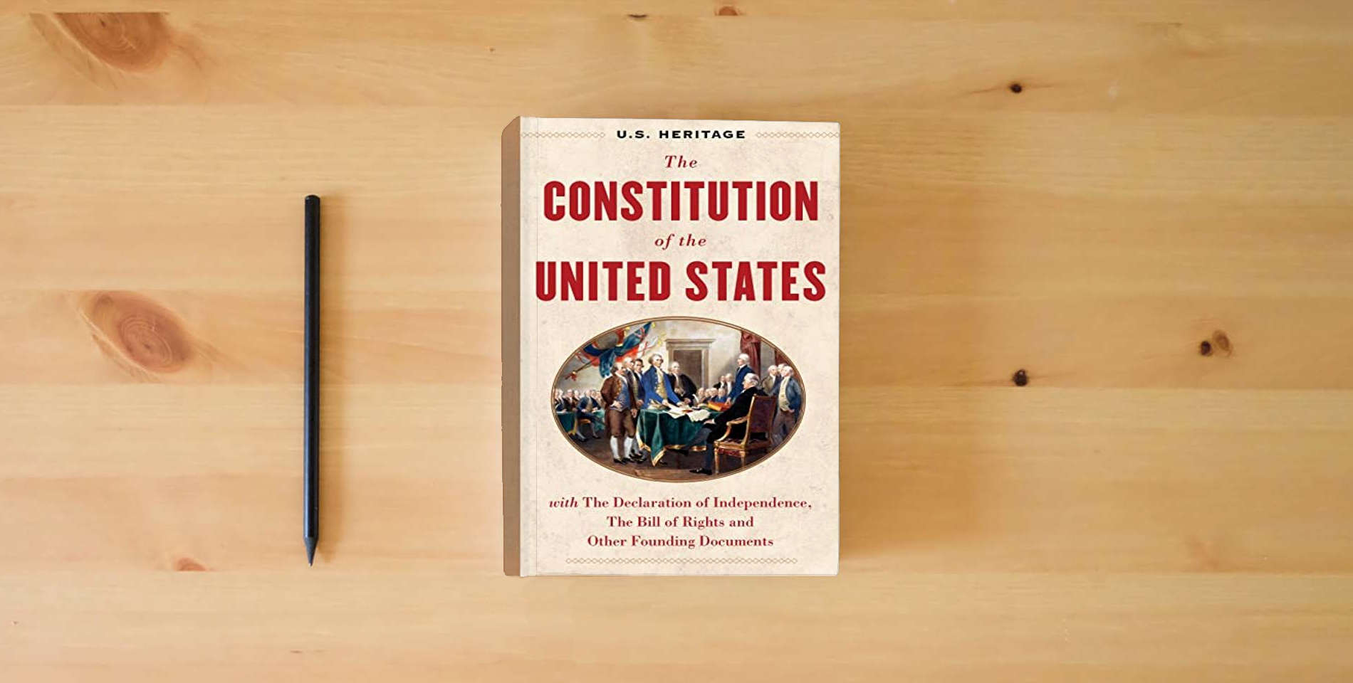The book The Constitution of the United States (U.S. Heritage): with The Declaration of Independence, The Bill of Rights and other Founding Documents with an ... by Constitutional Lawyer Alan Dershowitz is on the table