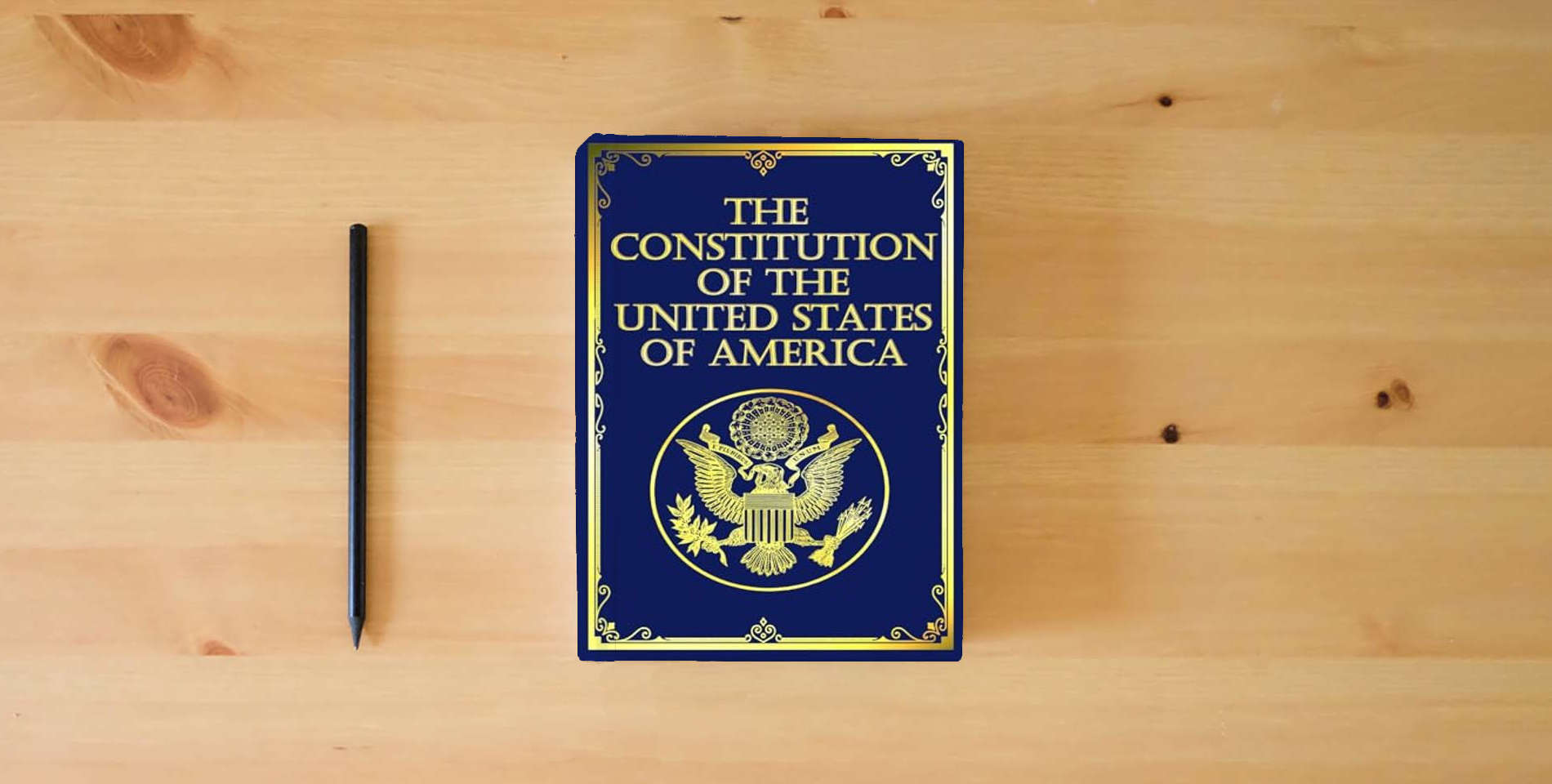 The book The Constitution of the United States: Large Print Edition is on the table
