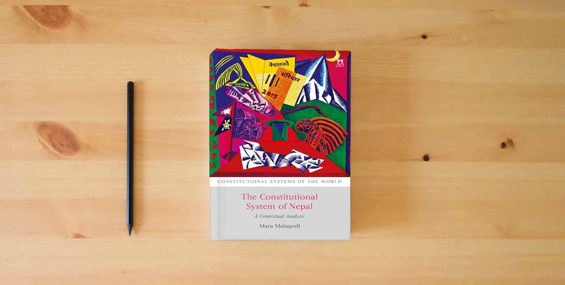 The book The Constitutional System of Nepal: A Contextual Analysis (Constitutional Systems of the World) is on the table