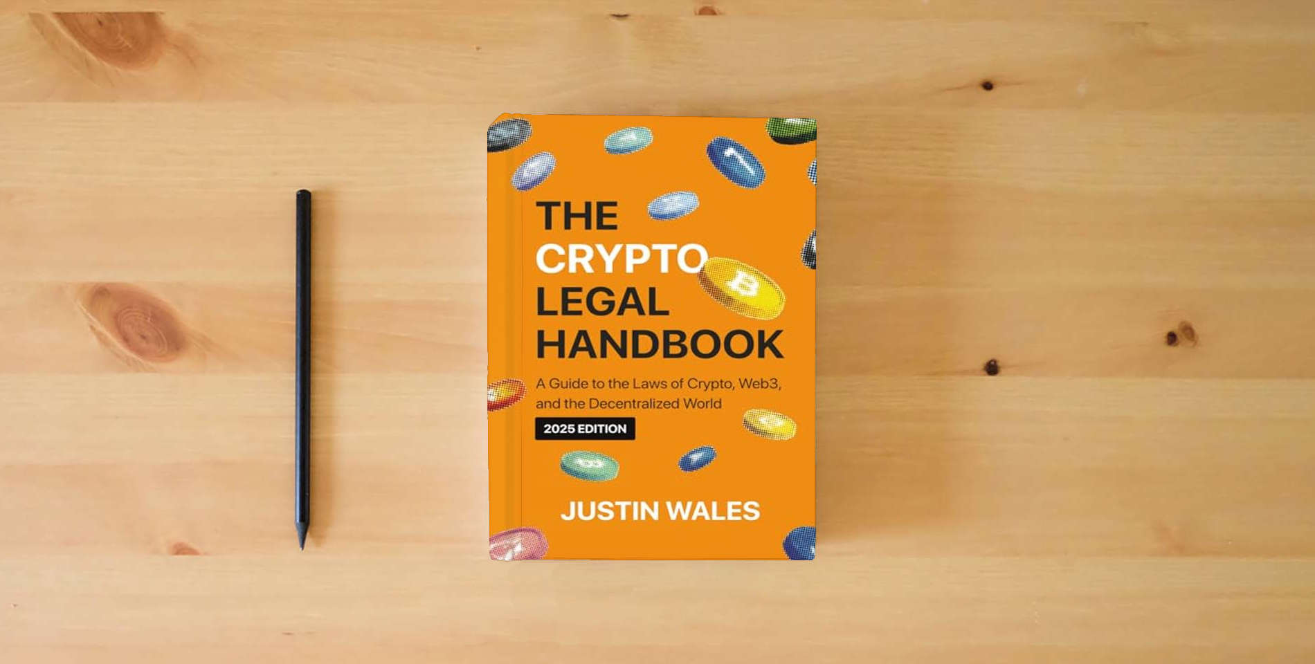 The book The Crypto Legal Handbook: A Guide to the Laws of Crypto, Web3, and the Decentralized World is on the table