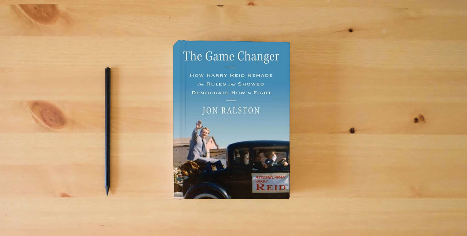 The book The Game Changer: How Harry Reid Remade the Rules and Showed Democrats How to Fight is on the table