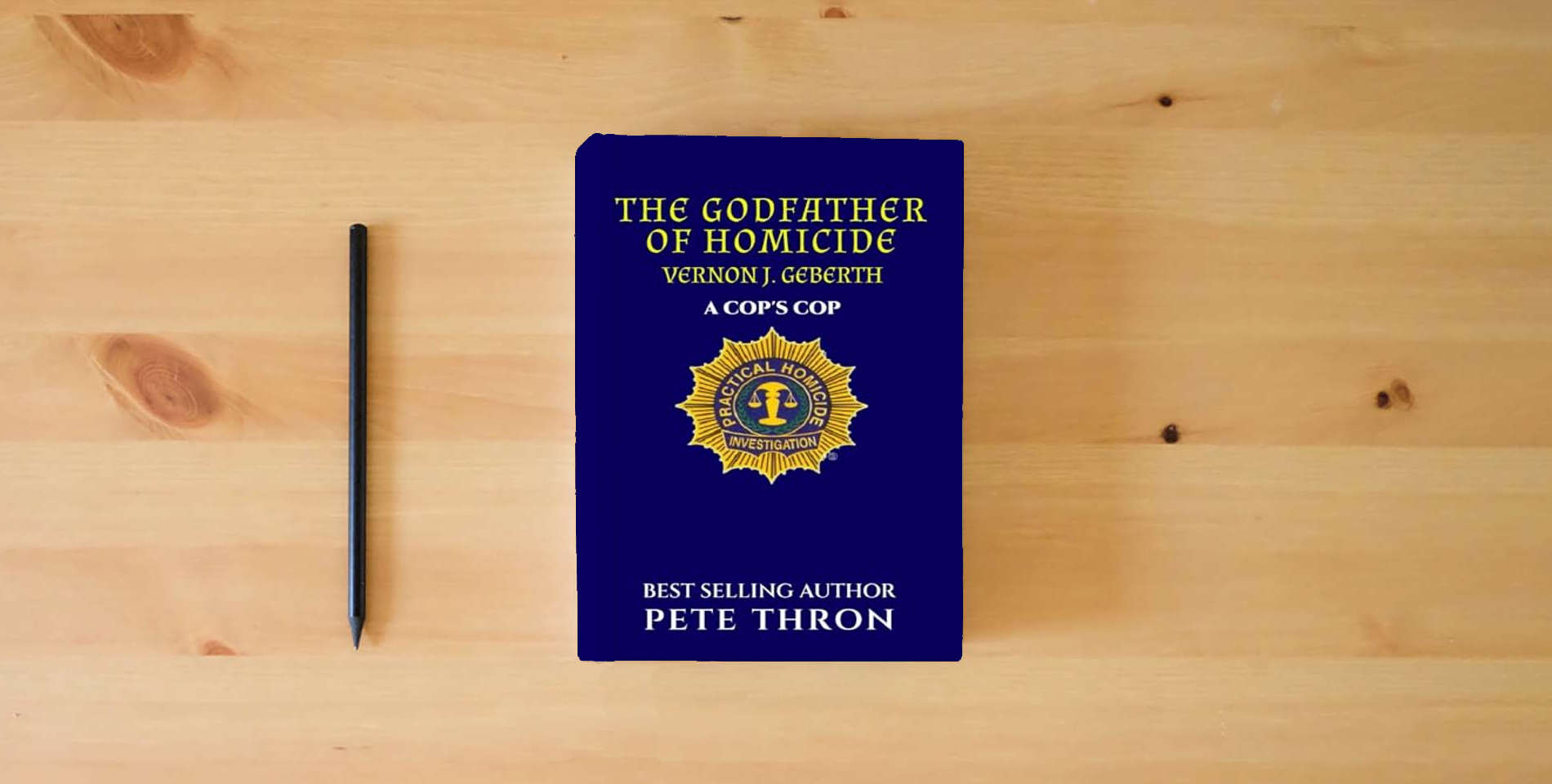 The book THE GODFATHER OF HOMICIDE: RET. Lieutenant-Commander Geberth is a legend in the NYPD. His expertise is world renowned. is on the table
