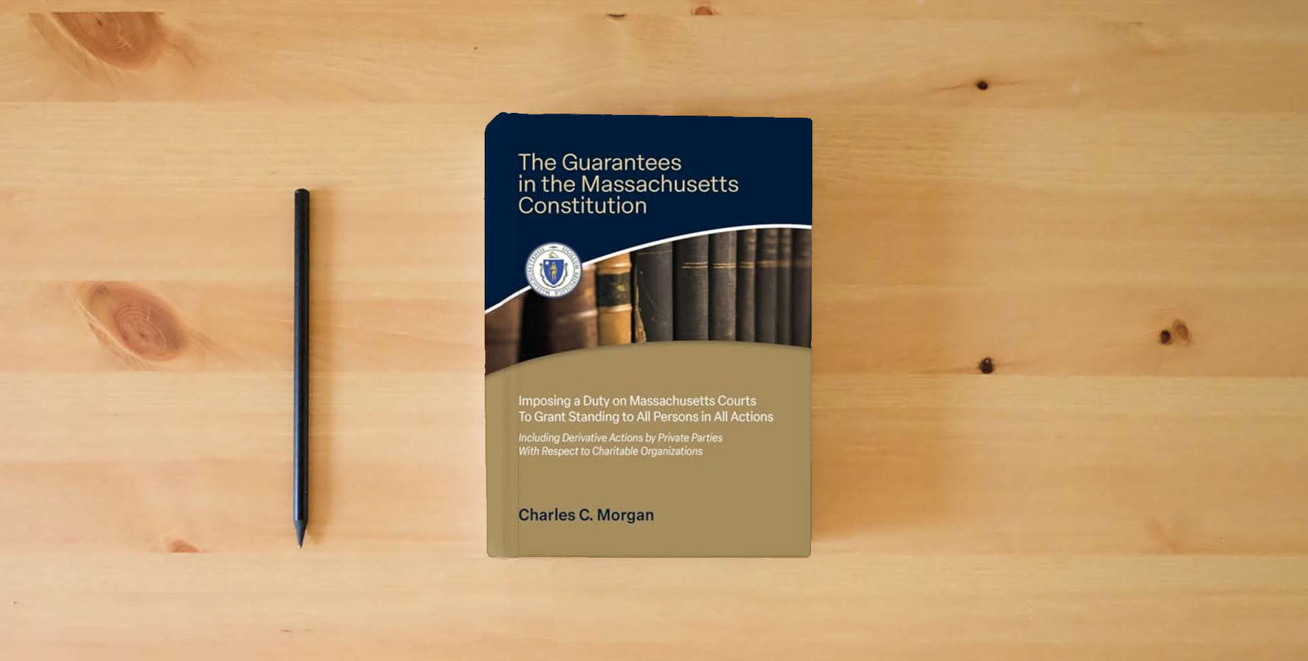 The book The Guarantees in the Massachusetts Constitution Imposing a Duty on Massachusetts Courts to Grant Standing to All Persons in All Actions is on the table