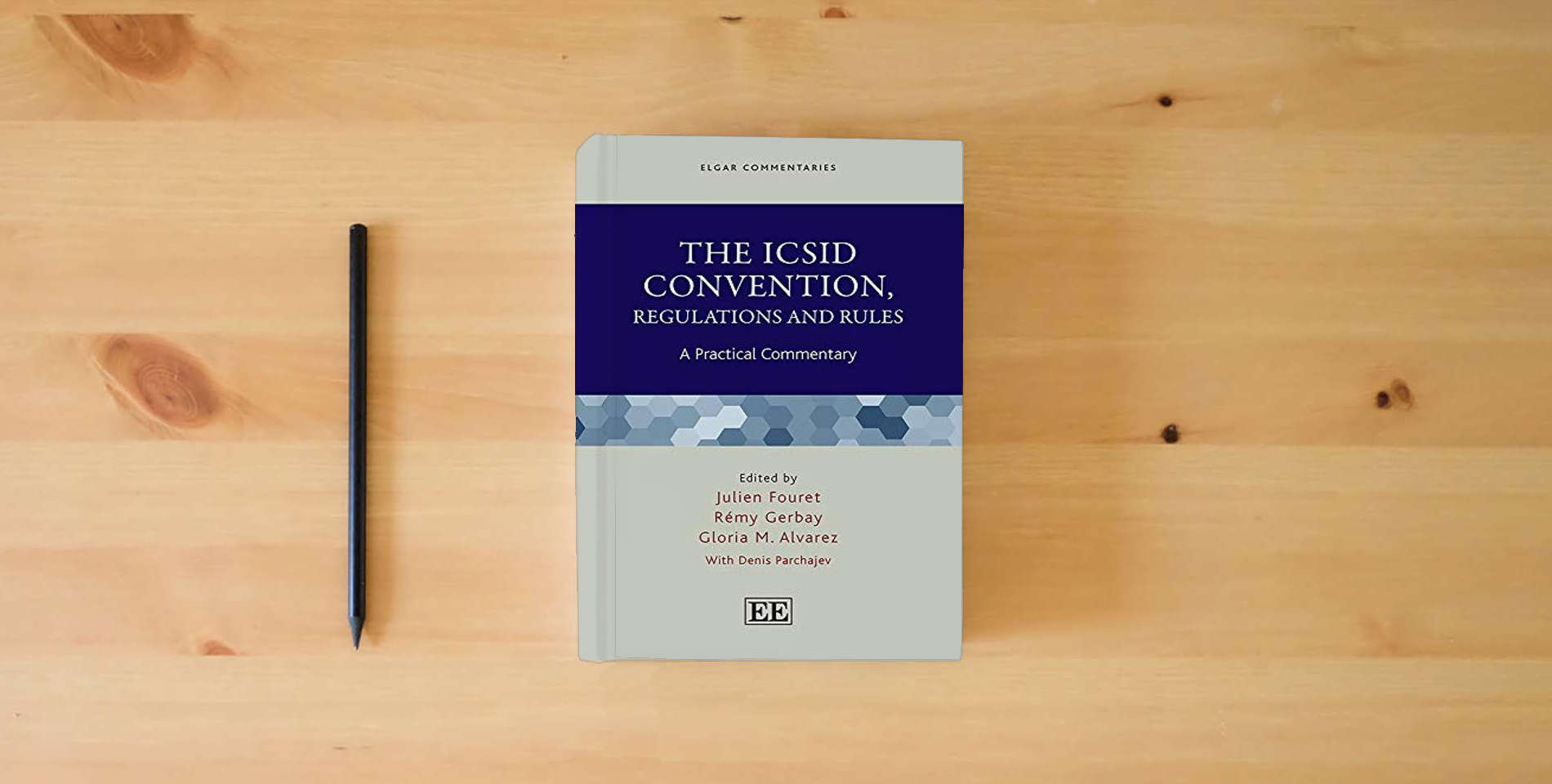 The book The ICSID Convention, Regulations and Rules: A Practical Commentary (Elgar Commentaries series) is on the table