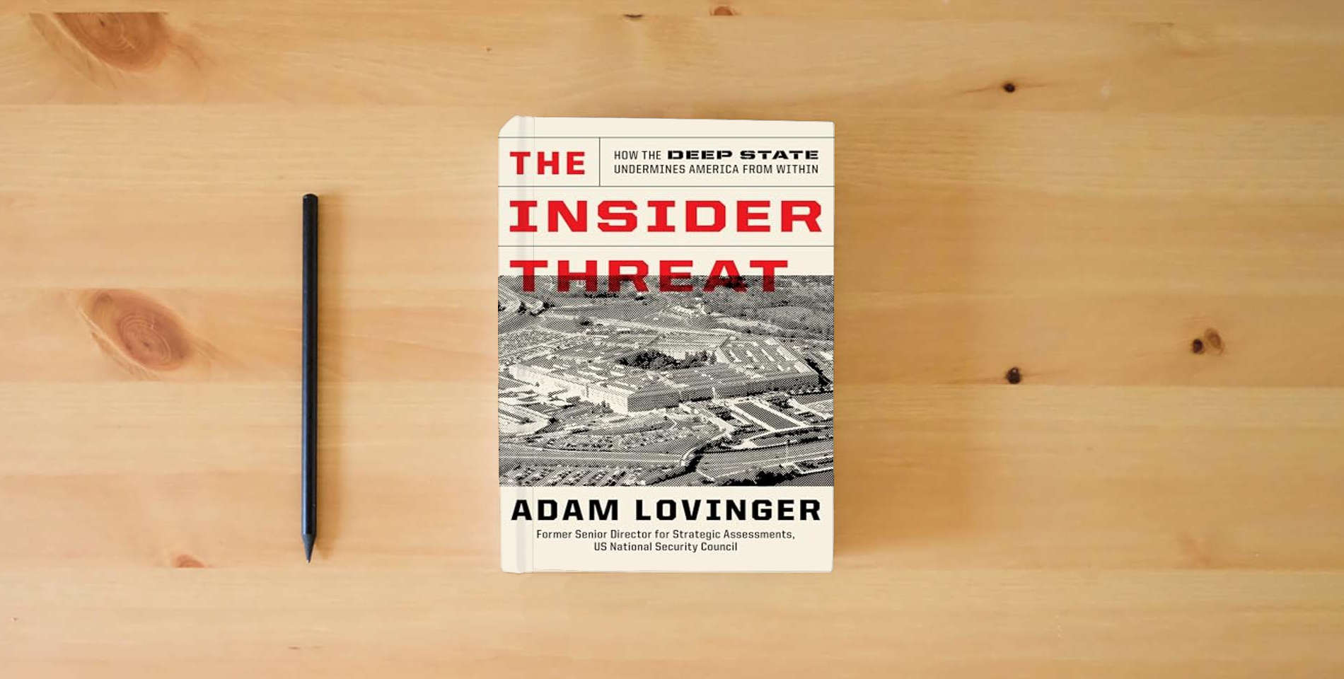 The book The Insider Threat: How the Deep State Undermines America from Within is on the table