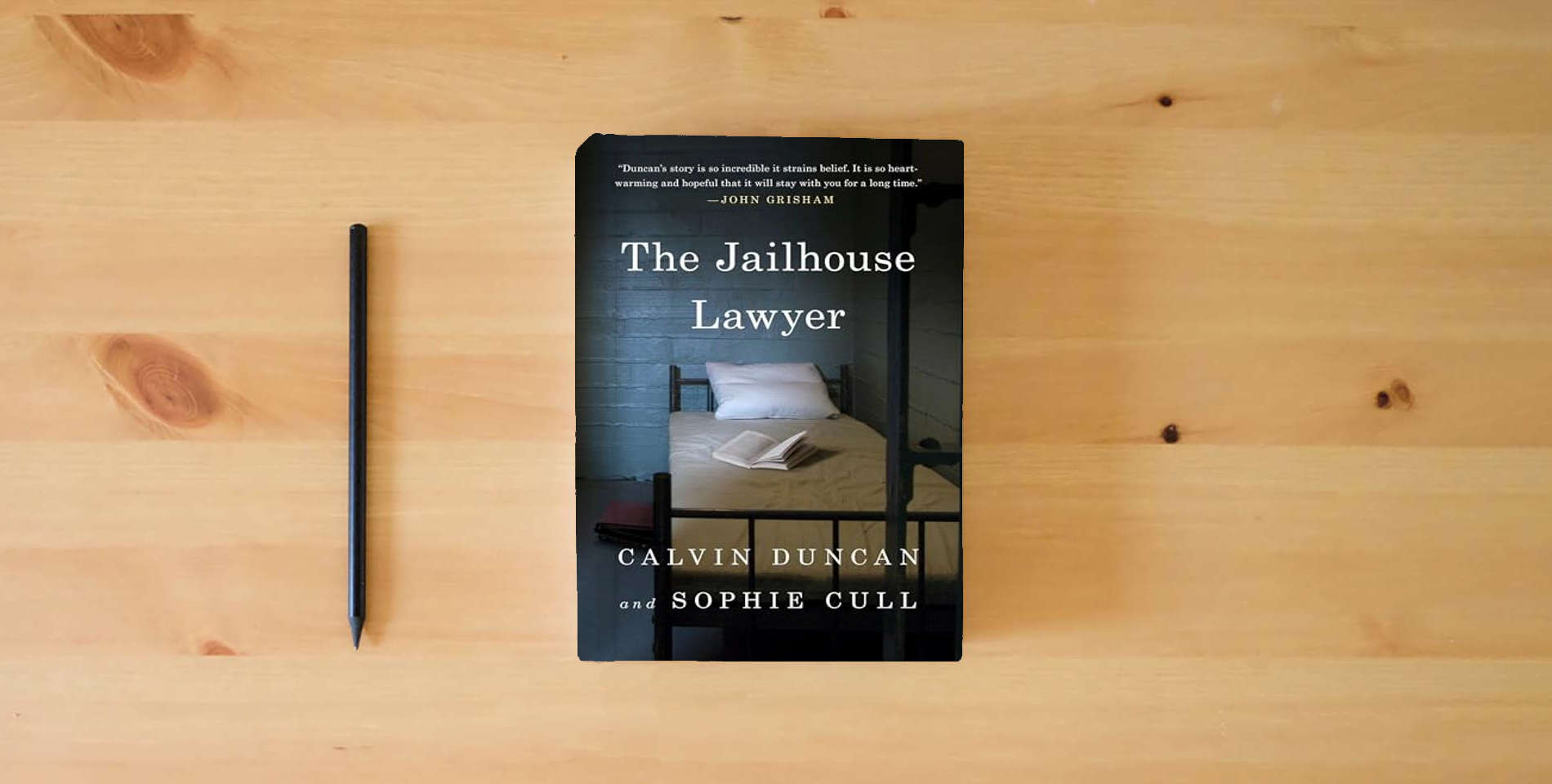 The book The Jailhouse Lawyer is on the table