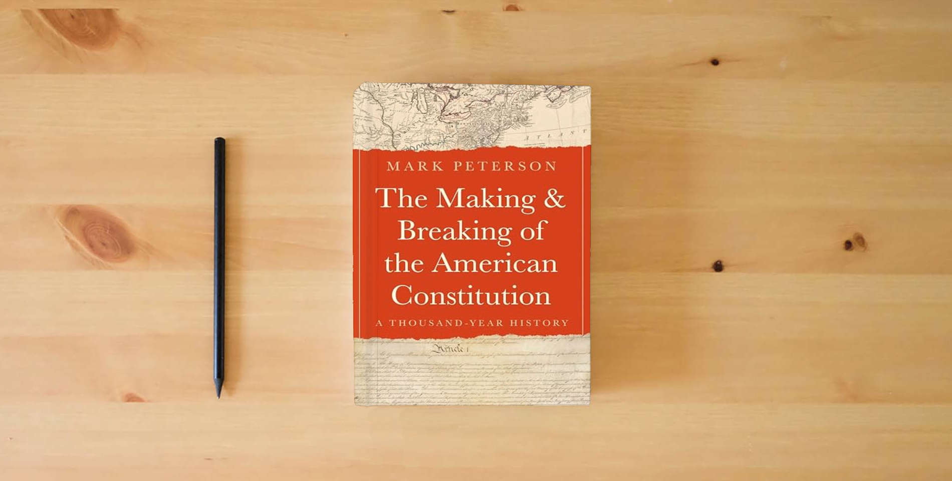 The book The Making and Breaking of the American Constitution: A Thousand-Year History is on the table