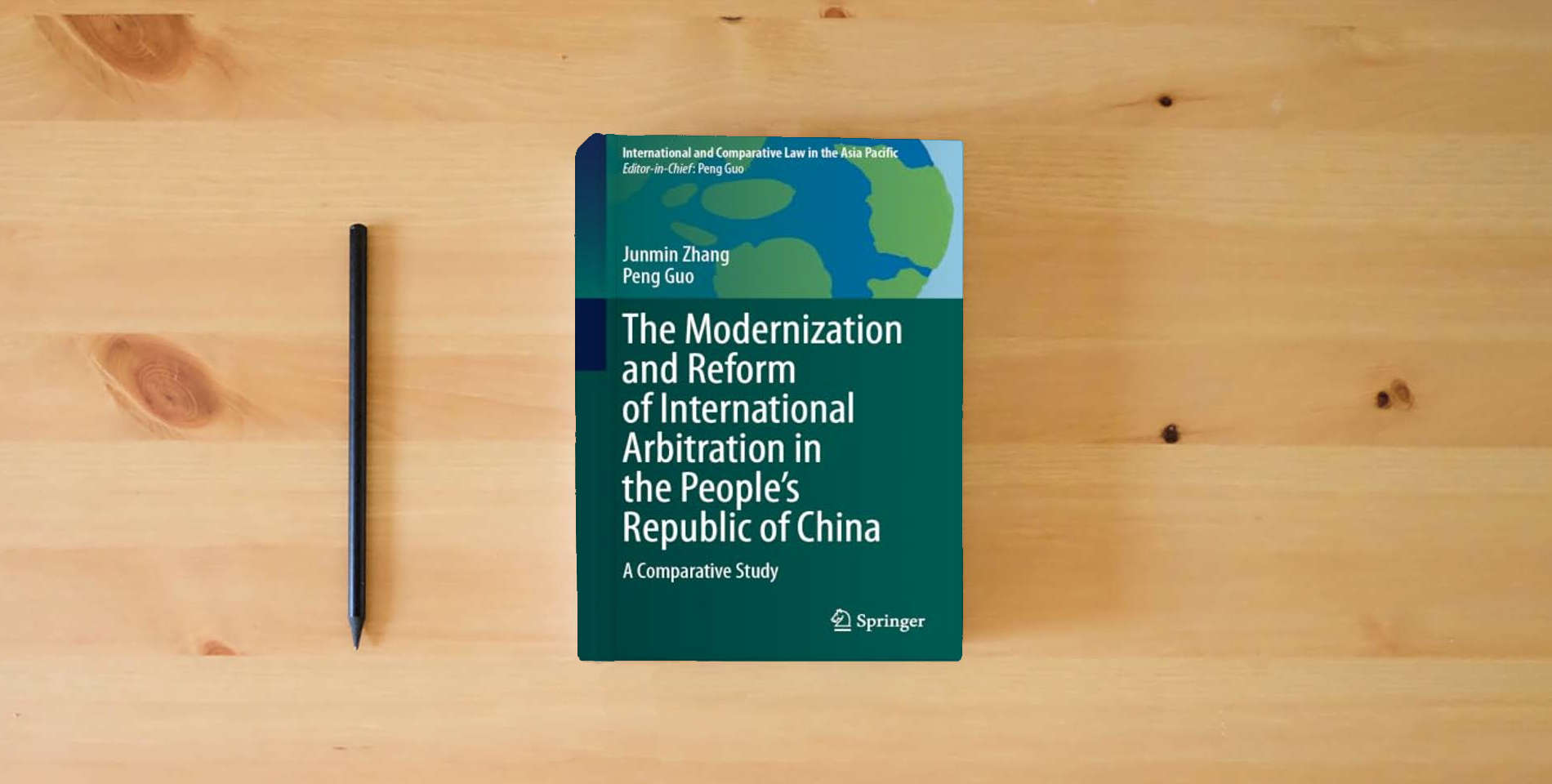 The book The Modernization and Reform of International Arbitration in the People’s Republic of China: A Comparative Study (International and Comparative Law in the Asia Pacific) is on the table