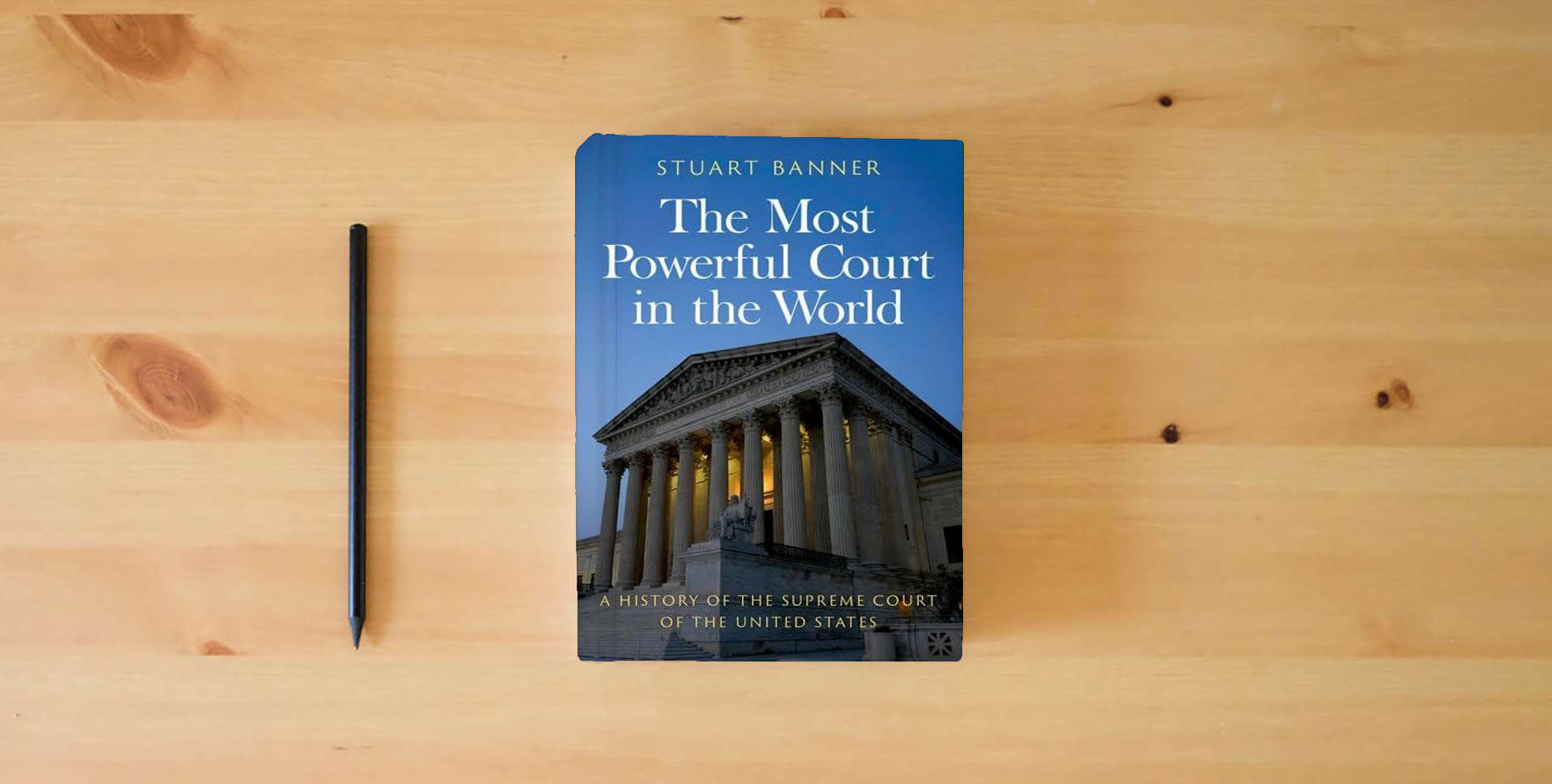 The book The Most Powerful Court in the World: A History of the Supreme Court of the United States is on the table