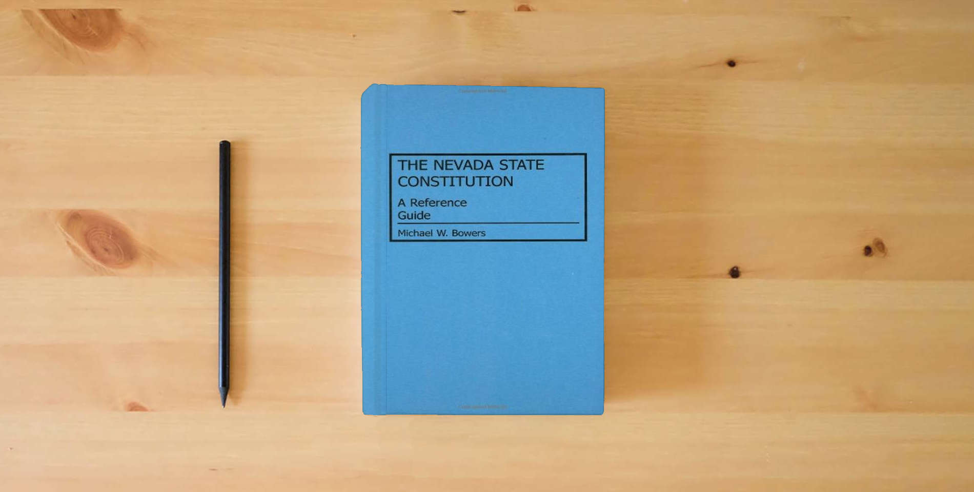 The book The Nevada State Constitution: A Reference Guide (Reference Guides to the State Constitutions of the United States) is on the table