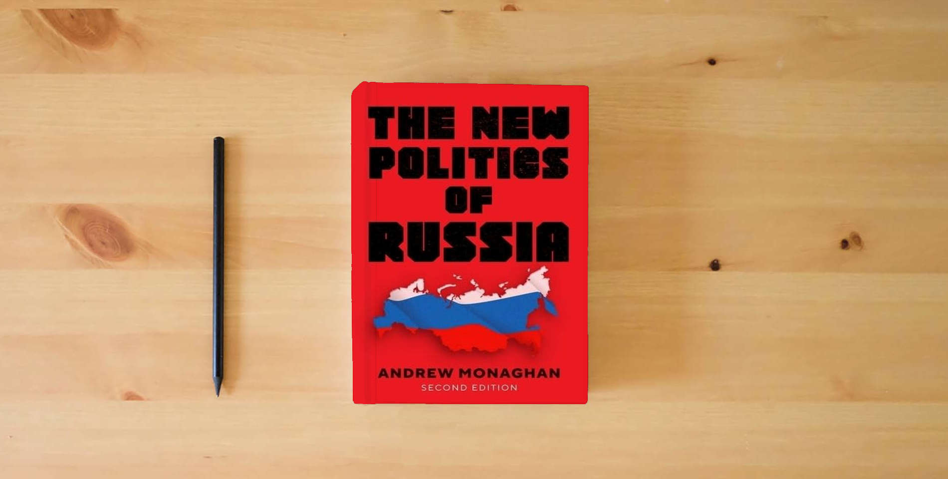The book The new politics of Russia: Second edition (Russian Strategy and Power) is on the table