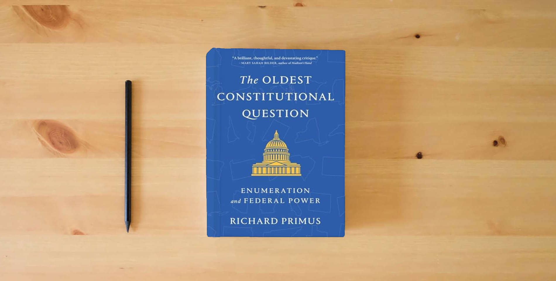 The book The Oldest Constitutional Question: Enumeration and Federal Power is on the table