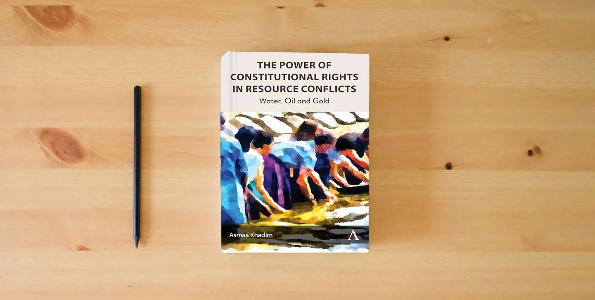 The book The Power of Constitutional Rights in Resource Conflicts: Water, Oil and Gold (Anthem Environment and Sustainability Initiative, 1) is on the table