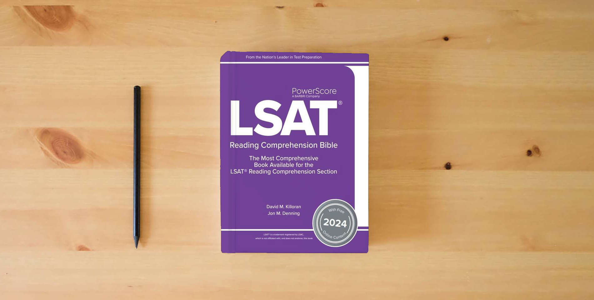 The book The PowerScore LSAT Reading Comprehension Bible 2024: Self-Study Prep Strategies for the Reading Comprehension Section of the LSAT (LSAT Prep) is on the table