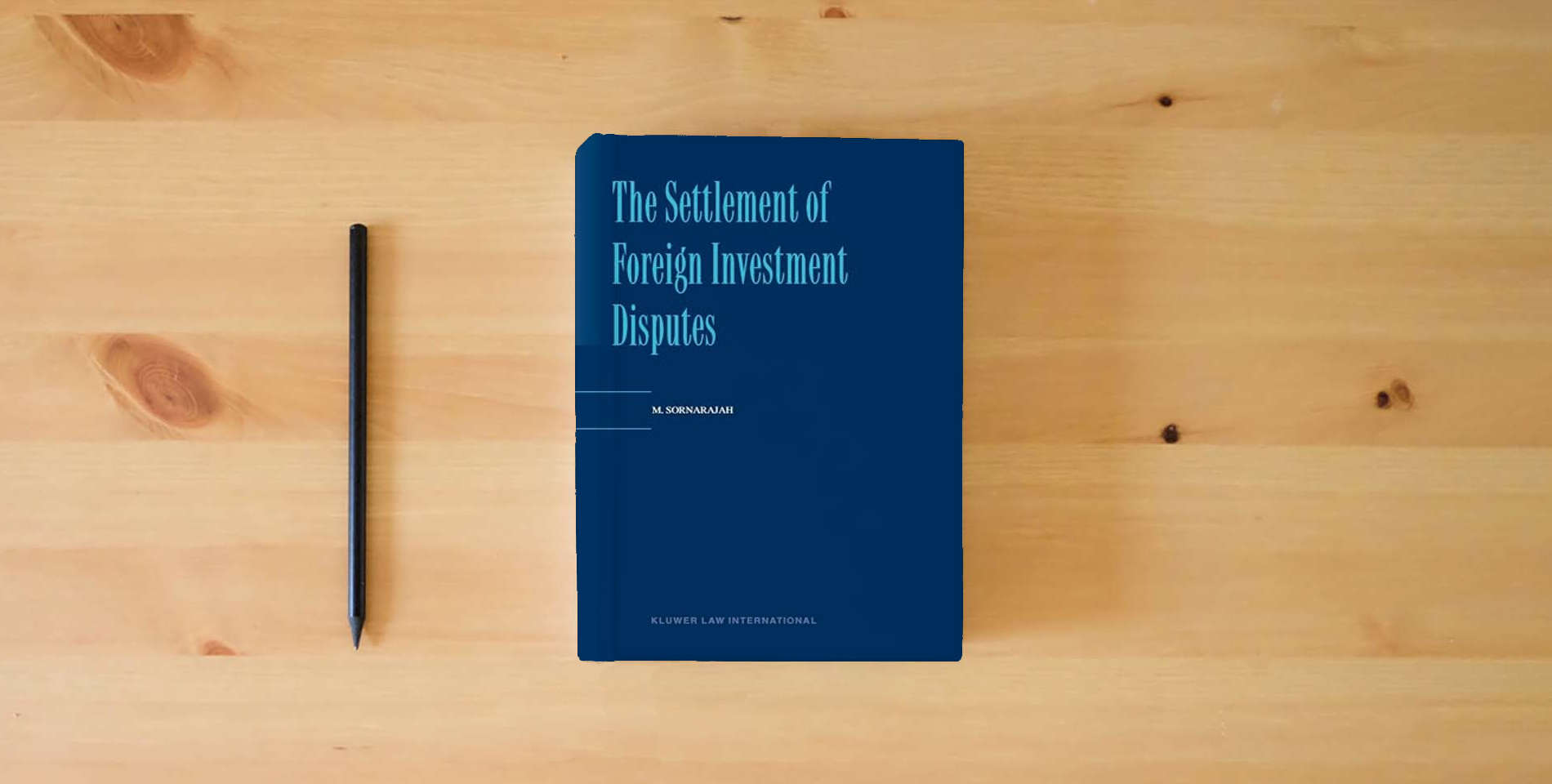 The book The Settlement of Foreign Investment Disputes is on the table