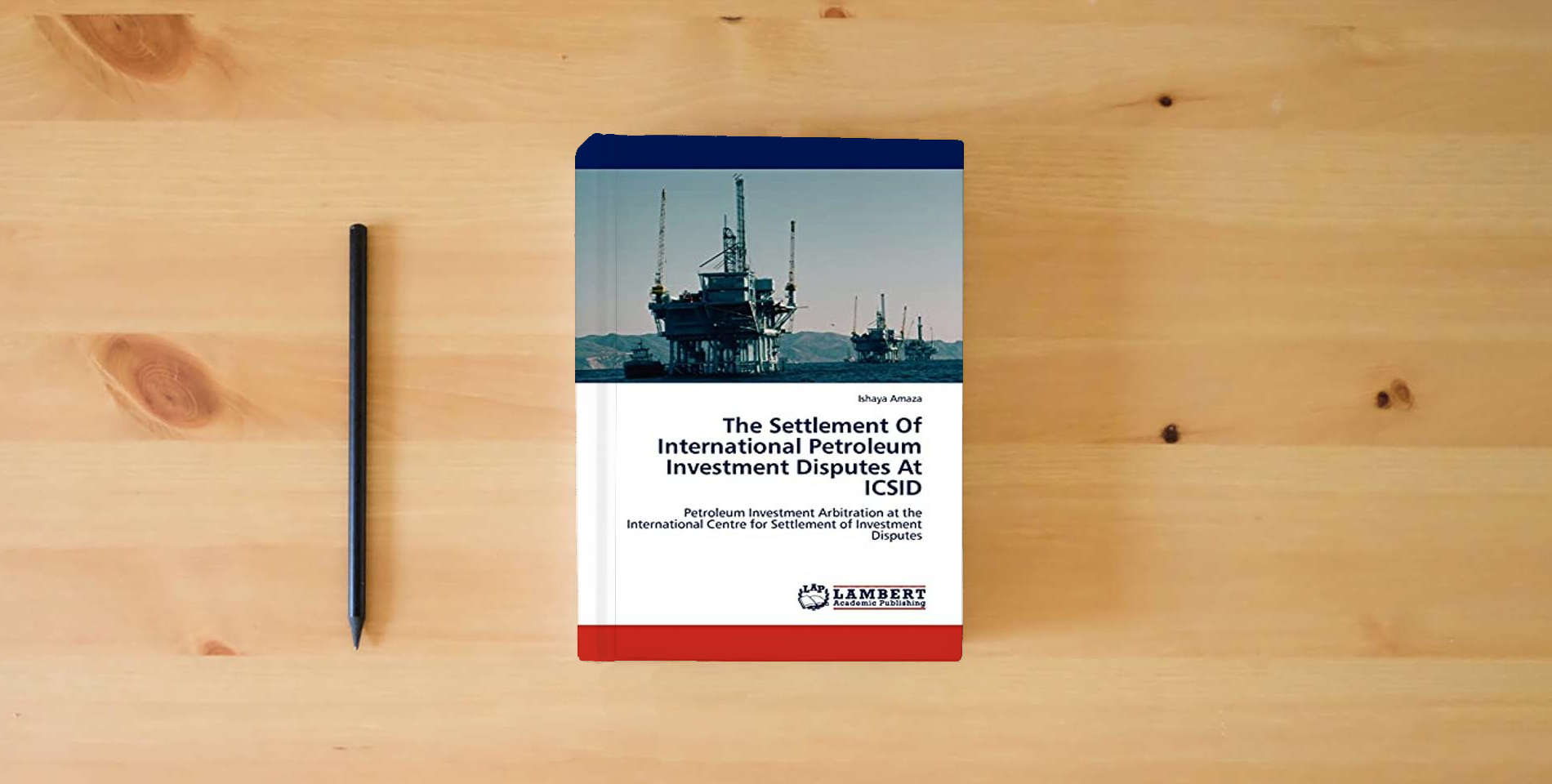 The book The Settlement Of International Petroleum Investment Disputes At ICSID: Petroleum Investment Arbitration at the International Centre for Settlement of Investment Disputes is on the table