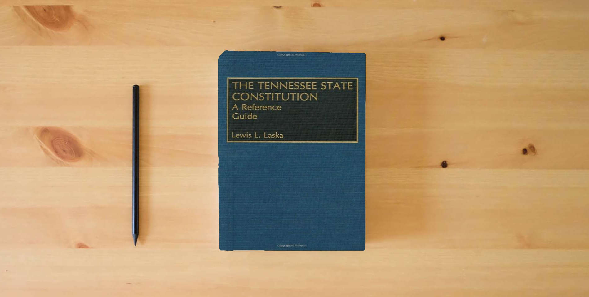 The book The Tennessee State Constitution: A Reference Guide (Reference Guides to the State Constitutions of the United States) is on the table