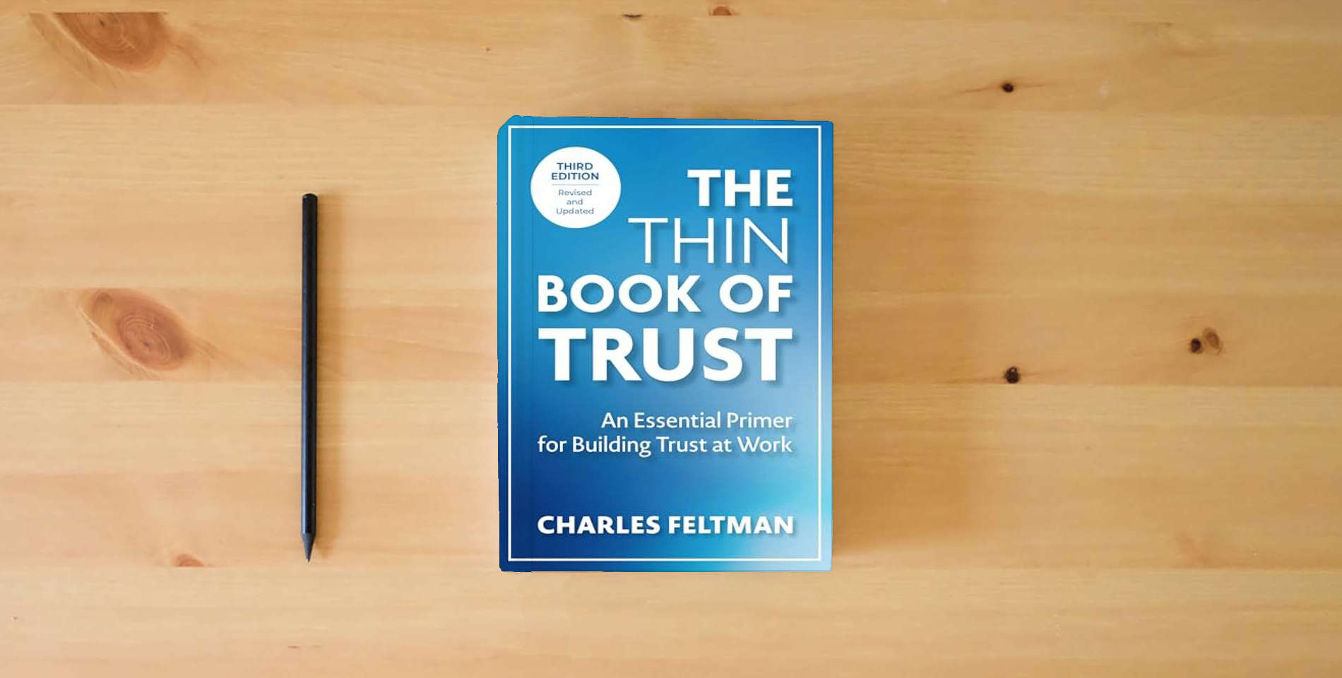 The book The Thin Book of Trust, Third Edition: An Essential Primer for Building Trust at Work is on the table