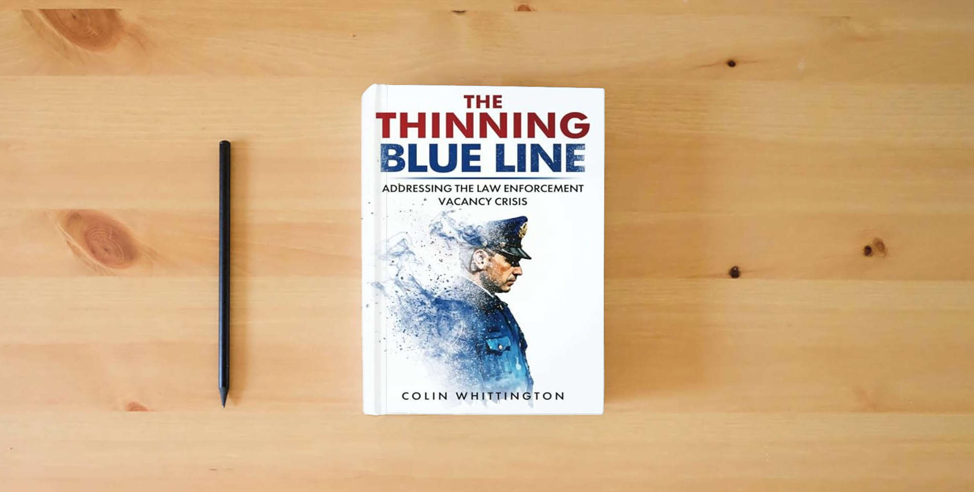 The book The Thinning Blue Line: Addressing the Law Enforcement Vacancy Crisis is on the table