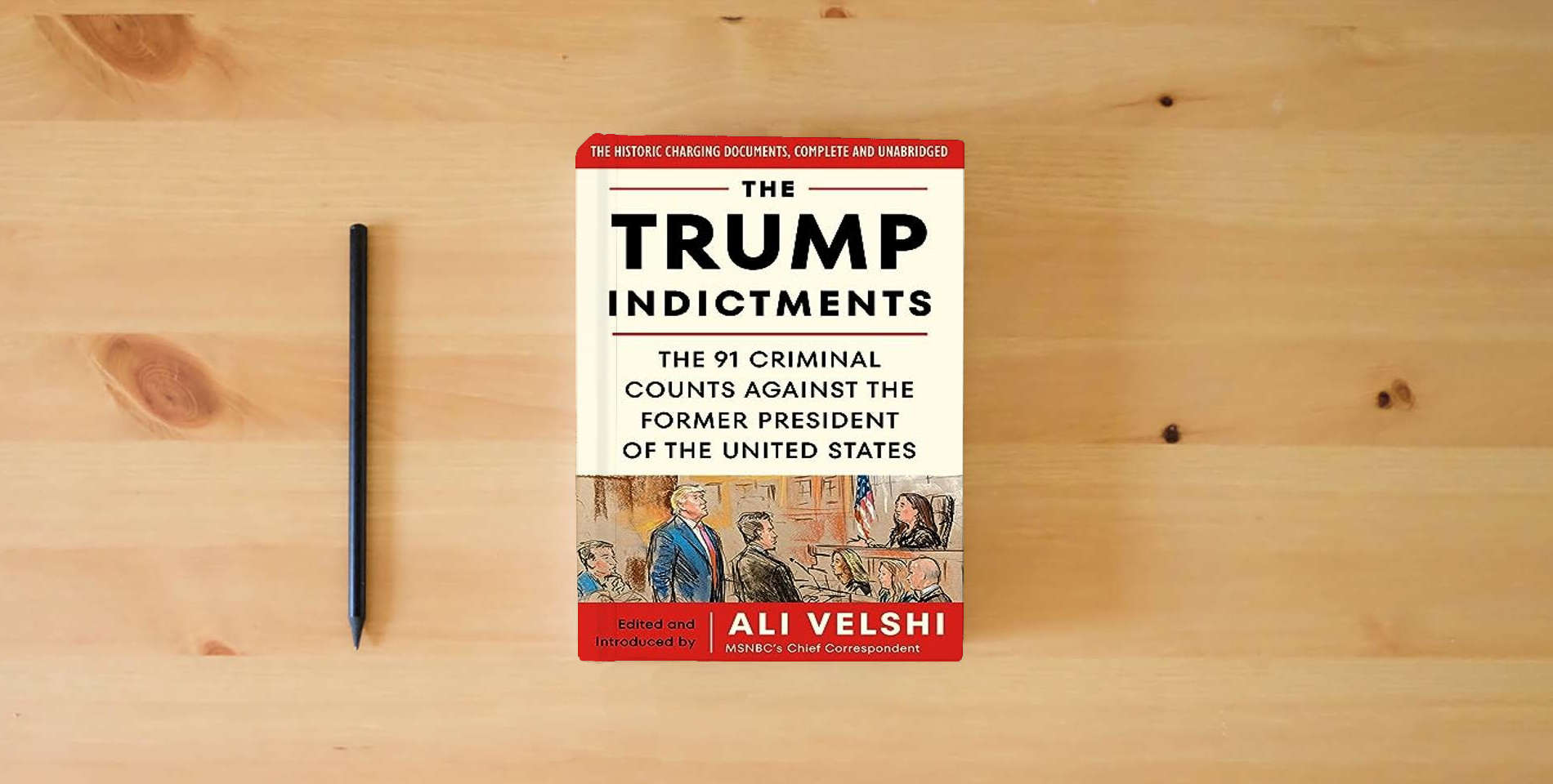 The book The Trump Indictments: The 91 Criminal Counts Against the Former President of the United States is on the table