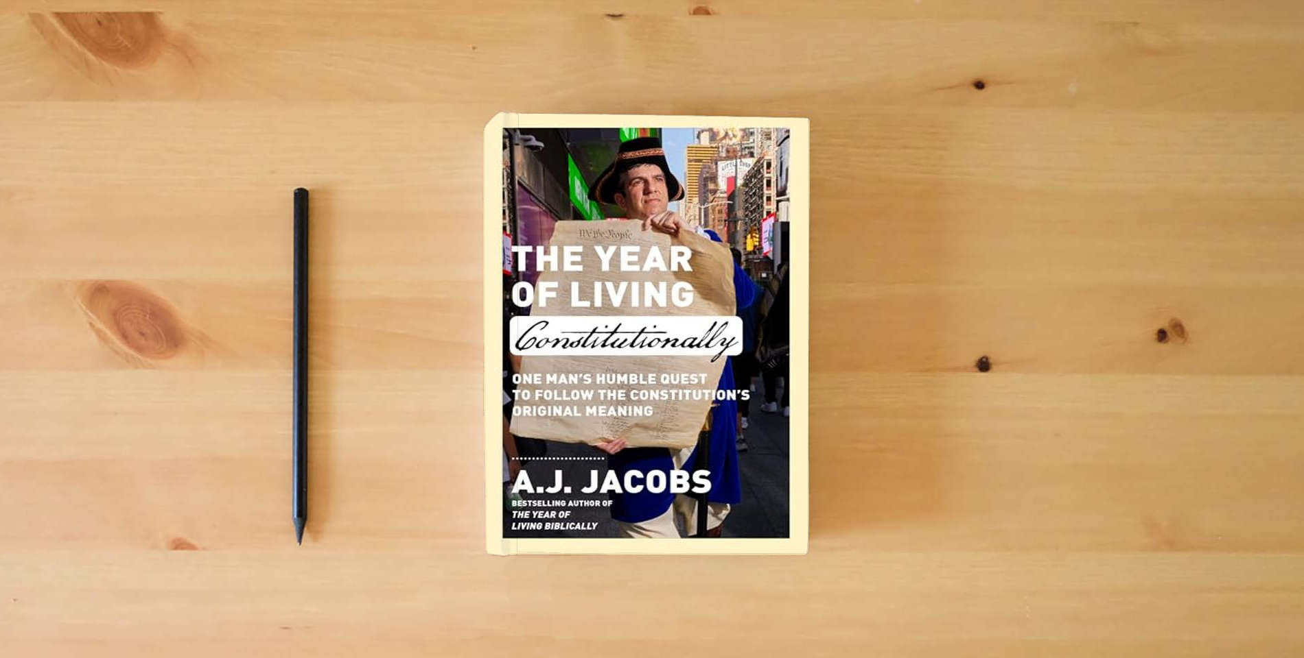 The book The Year of Living Constitutionally: One Man's Humble Quest to Follow the Constitution's Original Meaning is on the table